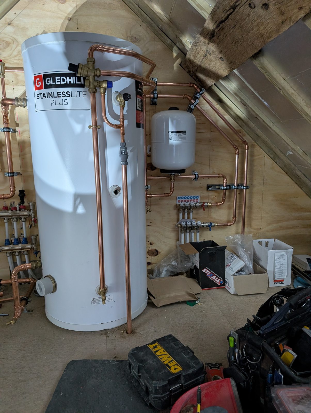 J6 hot water cylinder and underfloor heating distribution during installation
