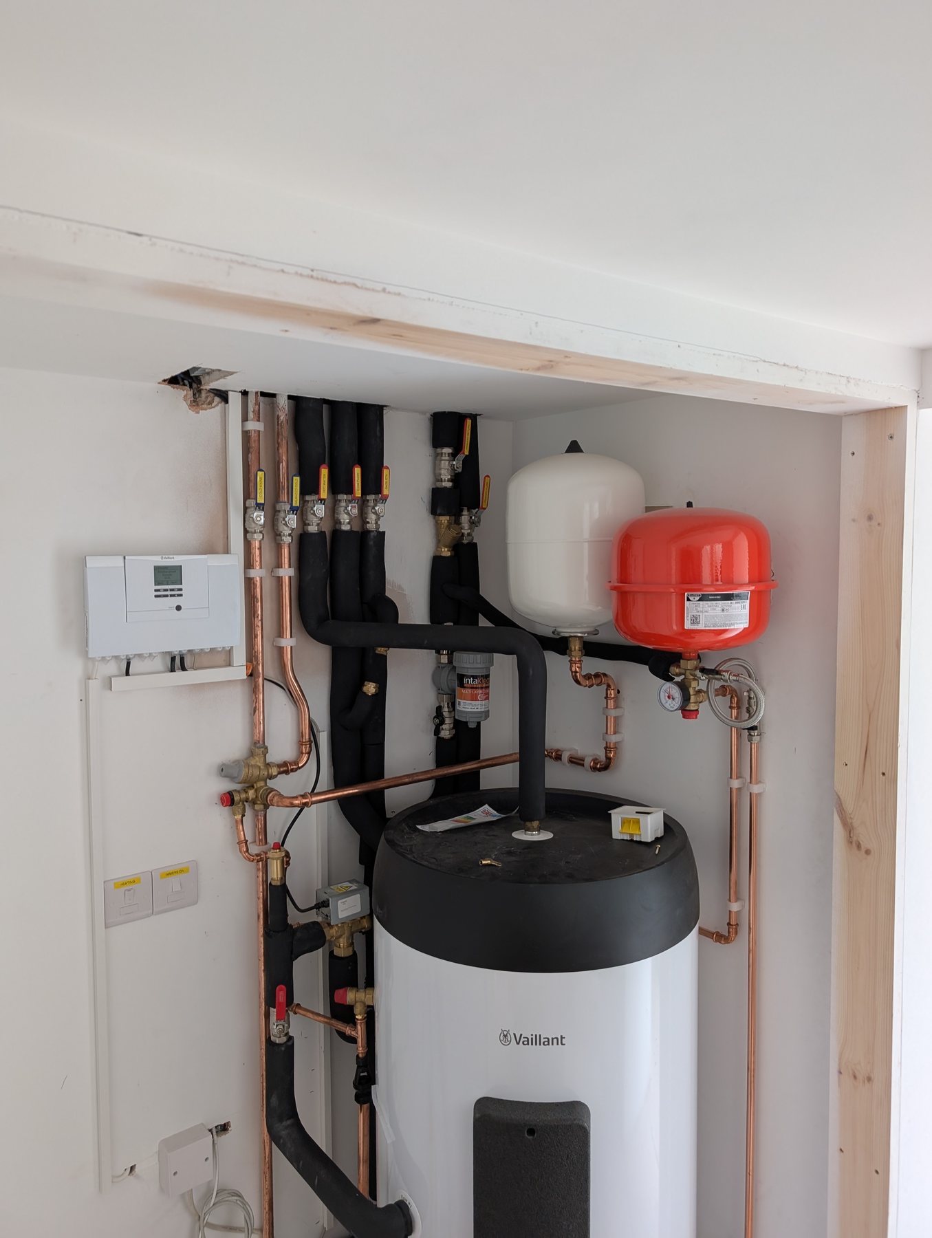 Vaillant hot water cylinder and neatly arranged pipework installed by J6